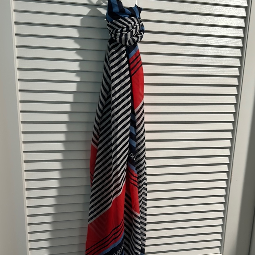 NWT Calvin Klein Long Scarf in Red, White and Black with Calvin Klein all over.